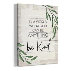 a wooden sign that says, in a world where you can be anything be kind