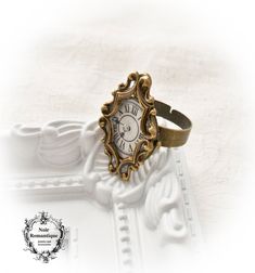 ♥♥Noir Romantique♥♥ Welcome to my store! A beautiful vintage cabochon placed under filigree ornate frame and is finally attached to an antique bronze adjustable ring ♥♥This ring is adjustable to fit all fingers ♥♥It will be sent to you in a beautiful gift box carefully wrapped through registered mail(this means that tracking number will be provided to you as soon as I send your order). ♥♥If you have any questions feel free to ask:) Vintage Bronze Handmade Rings, Handmade Gothic Gold Ring, Handmade Victorian Metal Rings, Vintage Metal Rings With Antique Finish, Vintage Antique Gold Brass Ring, Antique Gold Brass Vintage Ring, Vintage Bronze Metal Rings, Vintage Bronze Brass Ring, Vintage Bronze Brass Rings