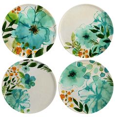 four plates with flowers painted on them in blue and green colors, each one has an orange center