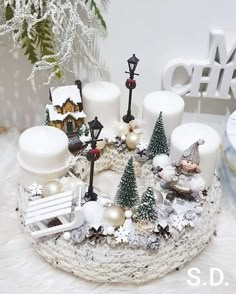 a white christmas cake with candles and decorations