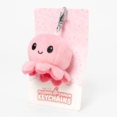 a pink plushie keychain with an octopus on it