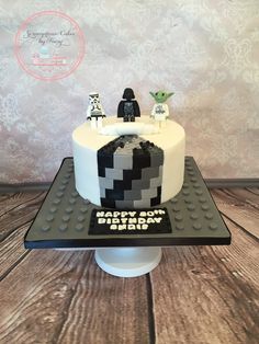 a star wars themed birthday cake with legos on top