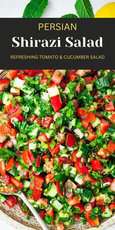 a salad with tomatoes, cucumber and parsley in it on a plate