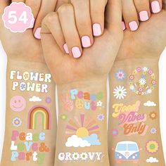 three girls with pink fingernails and tattoos on their arms