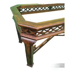 an old wooden bench with intricate carvings on the back and sides, isolated against a white background