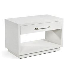 a white nightstand with one drawer open