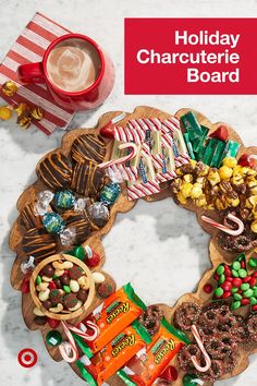 a holiday charcuterie board with candy, candies, and pretzels