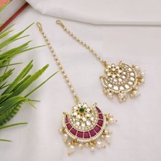 "Sabyasachi Pacchi Kundan Mang Tika /Kundan Mang Tika / Rajwadi Bollywood Mang Tika / Bridal Mang Tika/Ruby Emerald Mang Tika /Punjabi Tikka Made in Brass with Kundan, Pearls and Emerald/Ruby stones Lightweight Jewelry Pendant: 1.5\" Total Length: 5\" Mang Tika comes with Hook to attach to hair Suitable for any traditional attire/ Occasion Made with very high quality pearls" Kundan Mang Tika, Pearl Mang Tika, Mang Tika Designs, Luxury Festive Tikka For Diwali, Luxury Kundan Tikka With Cutdana, Luxury Gold Kundan Tikka, Luxury Temple Jewelry Tikka With Zari Work, Luxury Traditional Wedding Tikka, Luxury Elegant Tikka With Stone Work