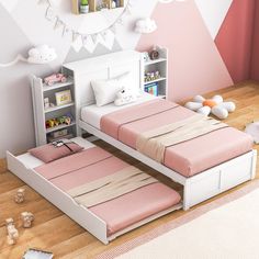 two twin beds with pink sheets and white headboards in a child's bedroom