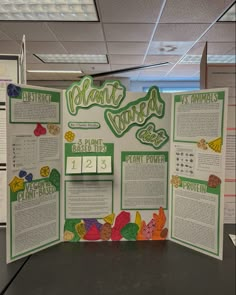 a bulletin board with information about plant based foods on it in an office cubicle