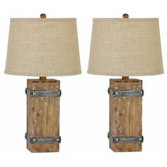 a pair of wooden table lamps with metal accents