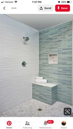 a bathroom with a glass tile shower wall