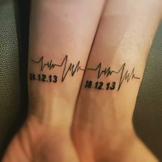 two wrist tattoos with heartbeats and date on each side, one is for his and her