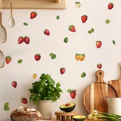 wall decals with strawberries and avocado on them in a kitchen area