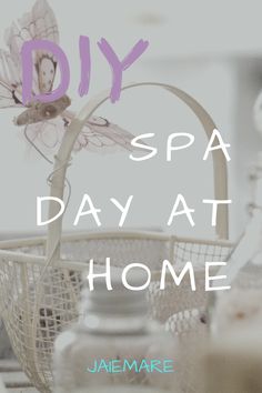 the words diy spa day at home are in front of a basket with flowers