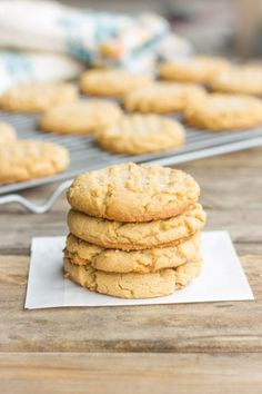 a stack of cookies sitting on top of a wooden table