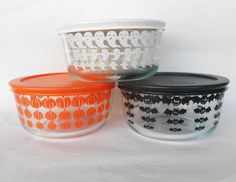 three glass bowls with halloween designs on them