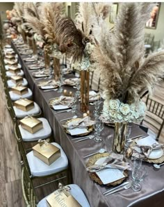 a long table with silver and gold place settings