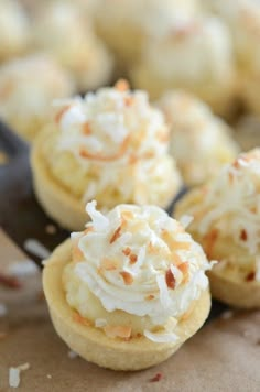 coconut cream filled cookies sitting on top of a cookie sheet