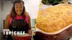 a woman holding a red bowl with food in it next to a large casserole dish