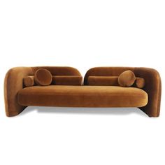 a brown couch sitting on top of a white floor