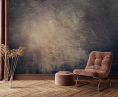 a chair and footstool in front of a wall with a painting on it