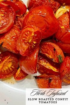 roasted tomatoes on a white plate with the words, slow roasted confit tomatoes