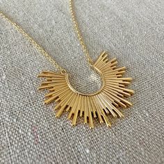 Just a beautiful sunrise to brighten up your day to wear around your neck. This necklace has some strong boho vibes with a touch of that popular sunburst seen in Mid-century décor. Wear it solo or layer it for a maximalist effect. Nickel free 14k gold plated brass Pendant [1.5"] Adjustable [+2" to chosen length] Proudly handmade in the USA Arrives gift boxed Chain Layering, Boho Mid Century, Sun Necklace, Box Handmade, Oval Earring, Chain Extenders, Beautiful Sunrise, Rising Sun, Necklace Boho