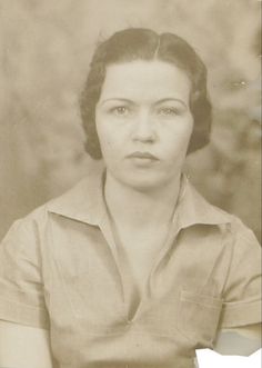 an old black and white photo of a woman