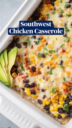 southwest chicken casserole with black beans, corn and avocado in a white casserole dish