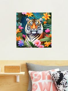 a tiger sitting on top of a bed in front of flowers and leaves framed print