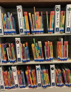 the shelves are full of books and pencils for children to use in their homes