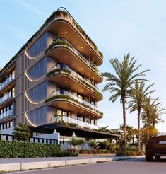 an apartment building with balconies and plants on the top floor, next to a parking lot