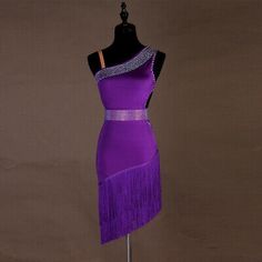 a mannequin dressed in a purple dress with fringes on it's sides