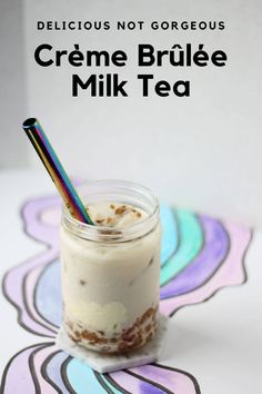 a glass jar filled with some kind of drink