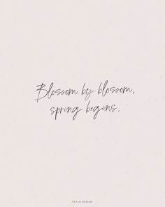 the words blossom by bloom, spring begins written in black ink on a white background