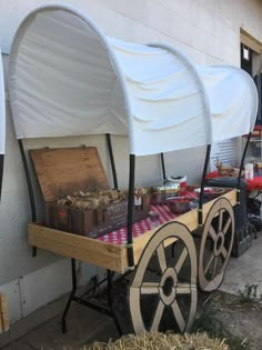 an old fashioned wagon is loaded with food