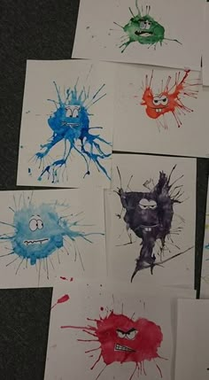 six handprints with different colored splatters on them, all in various shapes and sizes