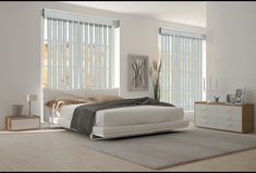 a modern bedroom with white furniture and large window blinds on the windowsill, along with a gray rug