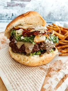 a burger and some french fries on a table