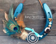 a blue leather necklace with feathers and beads