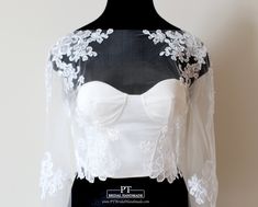 a white and black wedding dress on a mannequin