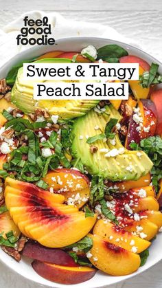 a white bowl filled with peaches, avocado and feta cheese on top