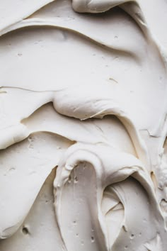 closeup of white icing with drops of water on it