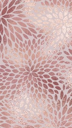 a pink and gold wallpaper with leaves on it