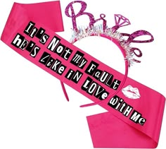 there is a pink ribbon with the word love on it and a tiara that says, it's not in full he's king i love with me