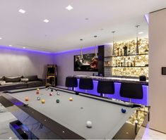 a pool table in the middle of a living room