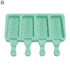 three ice trays that have been shaped like flower designs on them, one is green and the other is white