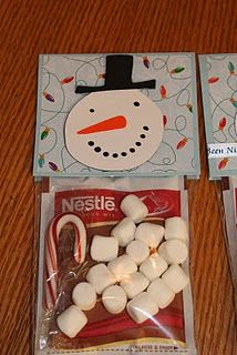 two bags of marshmallows sitting on top of a wooden table next to each other