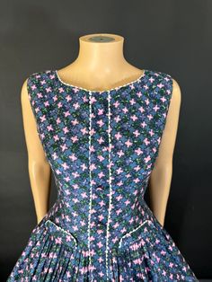 Such a cute little 1950s day dress in outstanding condition and in a wonderful polished cotton. The shape is really sweet that's dropped waste and lovely full skirt. It's absolutely adorable. it fastens the centre back zip has been washed and pressed.(petticoat not included) Bus 38 inches Waist 29 inches Waist to hem 23 inches +2 inch hem 1950s Style Cotton Lined Dress, Cotton 1950s Style Lined Dresses, Cotton Ruffle Dress With Full Skirt, Vintage Cotton Dress With Fitted Bodice, 1950s Cotton Buttoned Dresses, 1950s Style Cotton Dress With Buttons, Cotton A-line Vintage Dress, Fitted Cotton Vintage Dress For Garden Party, Cotton A-line Dress With Box Pleat